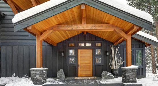 Covered Porch With Solid Wood Column Covered Porch With Solid Wood Column And Natural Stone Pedestal Cover. Gray exterior of Beautiful modern contemporary home. Northwest, USA